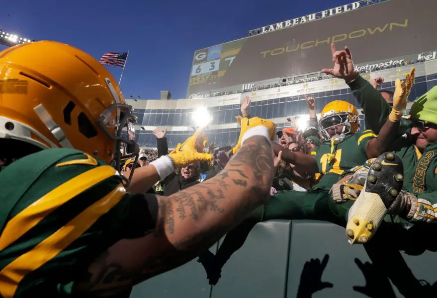 Green Bay Packers wide receiver Christian Watson (9) and wide receiver Jayden Reed (11) celebrate a touchdown against the Los Angeles Chargers during their football game Sunday, November 19, 2023, at Lambeau Field in Green Bay, WI. Glasheen USA TODAY NETWORK-Wisconsin
