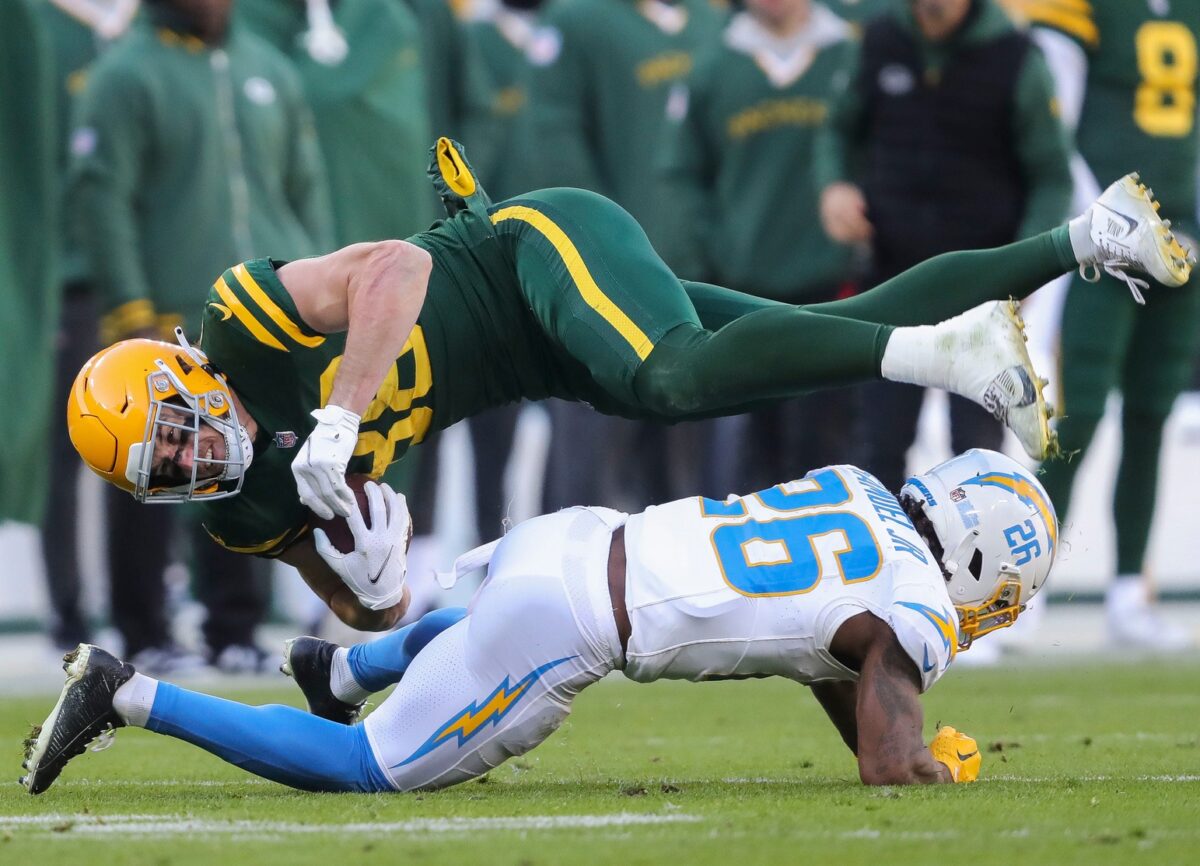 Green Bay Packers tight end Luke Musgrave (88) is upended by Los Angeles Chargers cornerback Asante Samuel Jr. (26) on Sunday, November 19, 2023, at Lambeau Field in Green Bay, Wis. The Packers won the game, 23-20. Tork Mason/USA TODAY NETWORK-Wisconsin