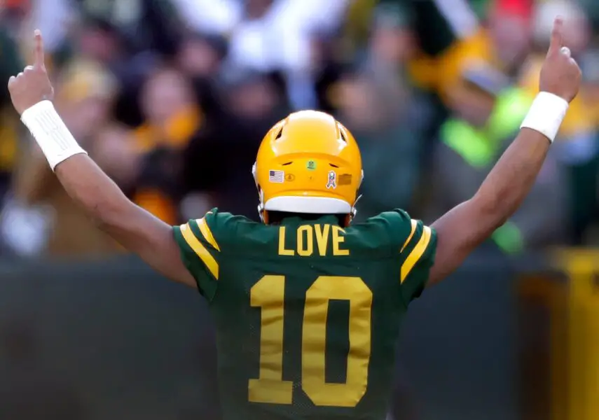 Green Bay Packers quarterback Jordan Love (10)reacts following a fourth quarter touchdown against the Los Angeles Chargers during their football game Sunday, November 19, 2023, at Lambeau Field in Green Bay, Wis. The Packers defeated the Chargers 23-20.