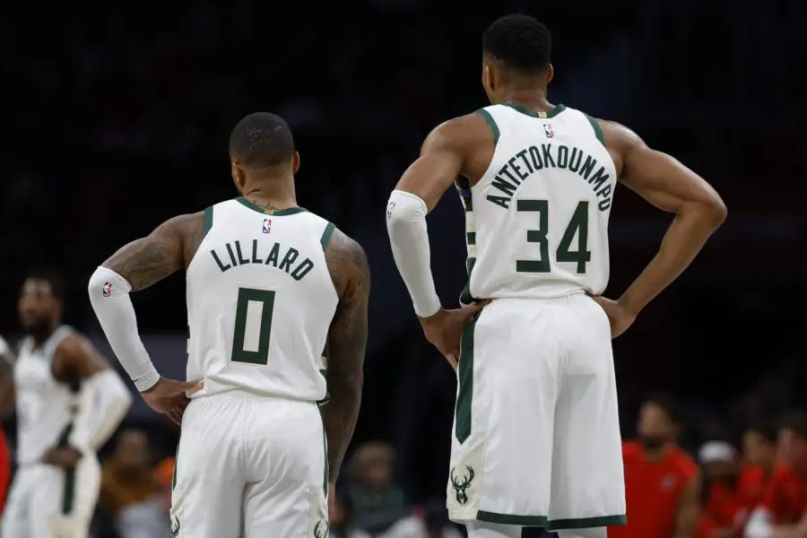 Nov 20, 2023; Washington, District of Columbia, USA; Milwaukee Bucks guard Damian Lillard (0) and Bucks forward Giannis Antetokounmpo (34) stand on the court against the Washington Wizards in the second quarter at Capital One Arena. Mandatory Credit: Geoff Burke-USA TODAY Sports