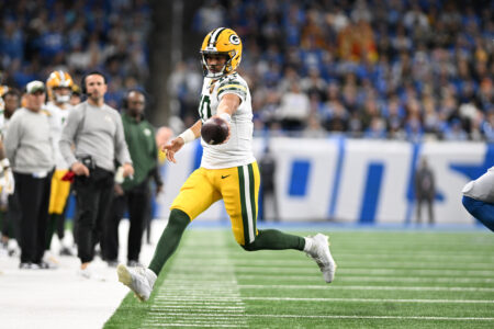 Nov 23, 2023; Detroit, Michigan, USA; Green Bay Packers quarterback Jordan Love (10) stretches the ball out for extra yardage as he runs out of bounds against the Detroit Lions in the first quarter at Ford Field. Mandatory Credit: Lon Horwedel-USA TODAY Sports