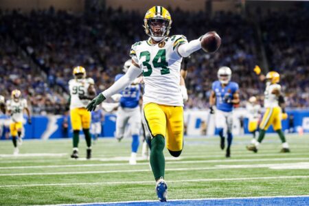 Green Bay Packers safety Jonathan Owens scores a touchdown on a fumble recovery return against the Detroit Lions during the first half at Ford Field in Detroit on Thursday, Nov. 23, 2023. © Junfu Han / USA TODAY NETWORK