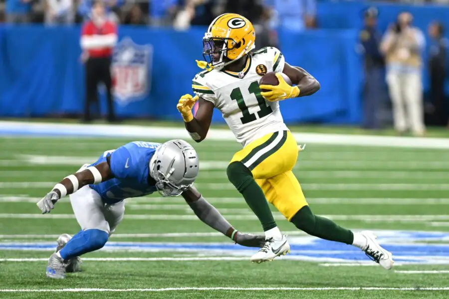 Nov 23, 2023; Detroit, Michigan, USA; Green Bay Packers wide receiver Jayden Reed (11) runs with the ball against the Detroit Lions in the third quarter at Ford Field. Mandatory Credit: Lon Horwedel-USA TODAY Sports
