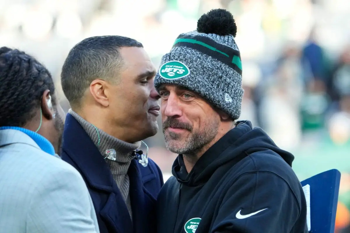 Nov 24, 2023; East Rutherford, New Jersey, USA; New York Jets quarterback Aaron Rodgers (8), on injured reserve, with broadcaster Tony Gonzalez, pregame against the Miami Dolphins at MetLife Stadium. Mandatory Credit: Robert Deutsch-USA TODAY Sports (Green Bay Packers)