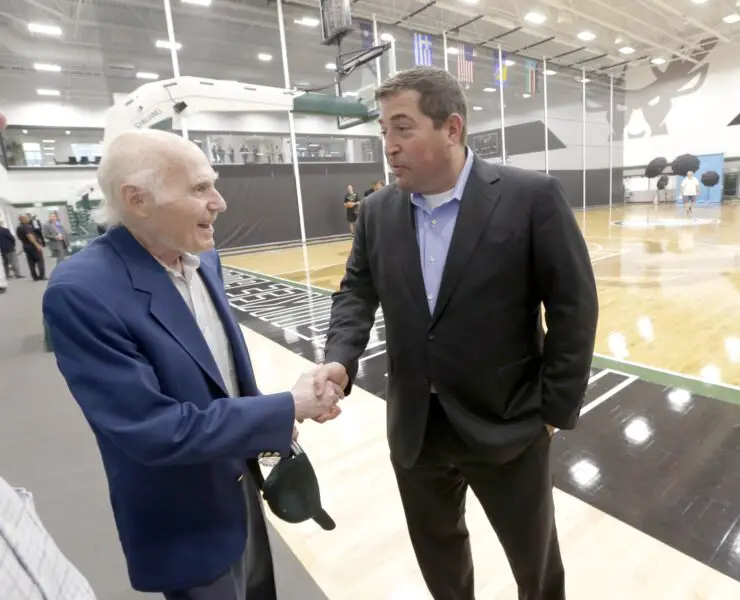 Sep 25, 2017; Milwaukee, WI, USA; Former Milwaukee Bucks owner Herb Kohl, left, shakes hands with Milwaukee Bucks president Peter Feigin during media day at Froedtert & the Medical College of Wisconsin Sports Science Center. Mandatory Credit: Mike De Sisti/Milwaukee Journal Sentinel via USA TODAY NETWORK