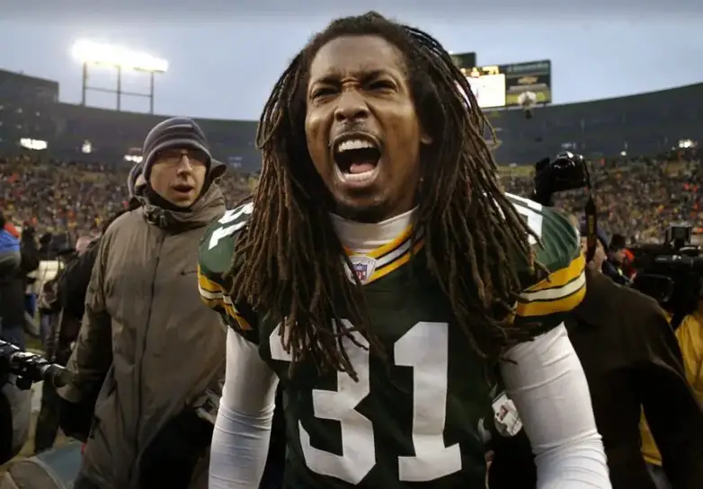 Green Bay Packers Al Harris exalts after he returned an interception for the game-winning touchdown in overtime against the Seattle Seahawks Sunday, January 4, 2004 at Lambeau Field in Green Bay, Wis. © Tom Lynn, Milwaukee Journal Sentinel via Imagn Content Services, LLC