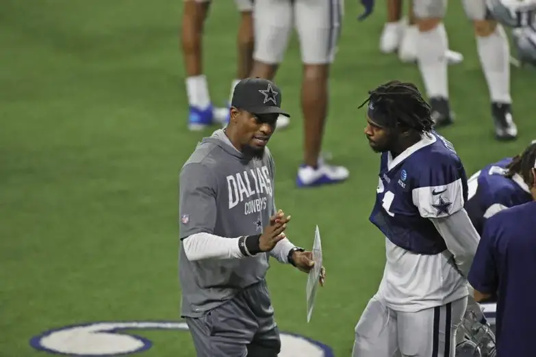 Aug 24, 2020; Frisco, TX, USA; Dallas Cowboys player Trevon Diggs (right) talks with Al Harris (left) during training camp at Ford Center at The Star in Frisco, Texas. Mandatory Credit: James D. Smith via USA TODAY Sports (Green Bay Packers)
