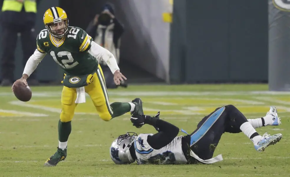 Dec 19, 2020; Green Bay, WI, USA; Green Bay Packers quarterback Aaron Rodgers (12) is sacked by Carolina Panthers defensive end Brian Burns (53) in the fourth quarter during their football game Saturday, December 19, 2020, at Lambeau Field in Green Bay, Wis. Mandatory Credit: Dan Powers-USA TODAY NETWORK