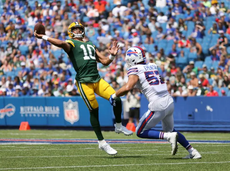 Packers quarterback Jordan Love tries to throw the ball away as he is pressured by Bills A.J. Epenesa. The pass was intercepted n the end zone by Micah Hyde. © Jamie Germano via Imagn Content Services, LLC