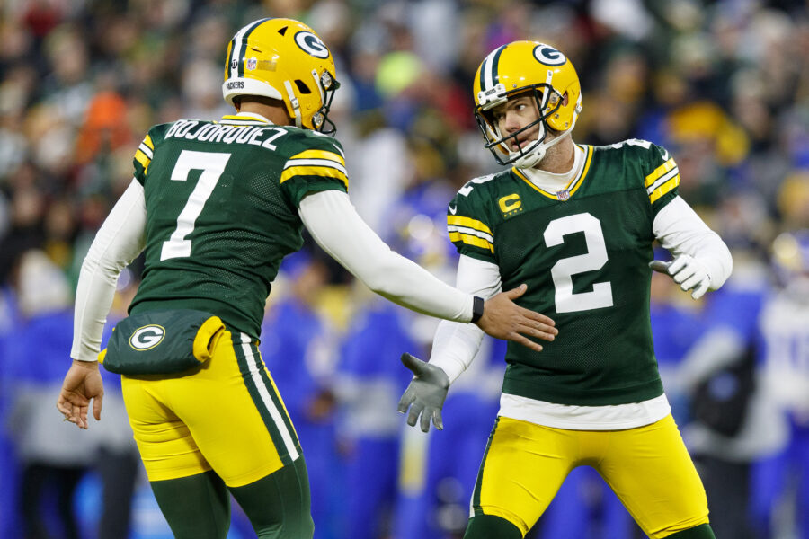 Nov 28, 2021; Green Bay, Wisconsin, USA; Green Bay Packers kicker Mason Crosby (2) celebrates with punter Corey Bojorquez (7) after making a field goal during the second quarter against the Los Angeles Rams at Lambeau Field. Mandatory Credit: Jeff Hanisch-USA TODAY Sports