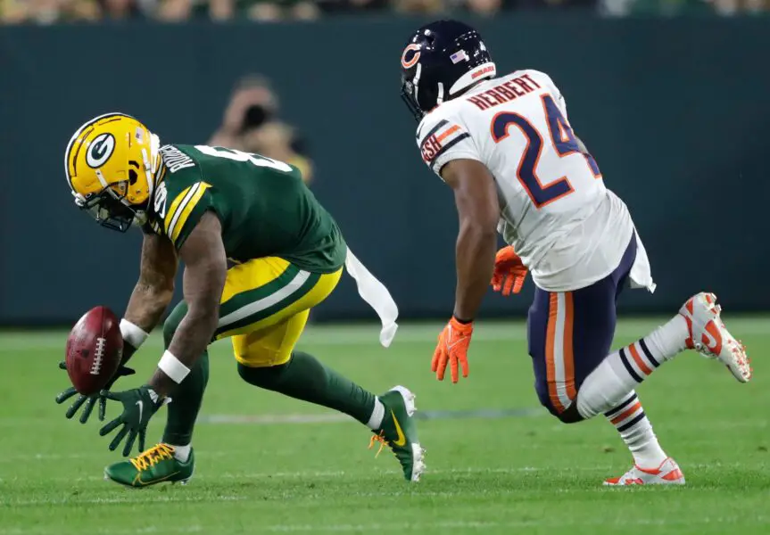 Green Bay Packers wide receiver Amari Rodgers (8) coughs up the ball on a punt return against Chicago Bears running back Khalil Herbert (24) during their football game Sunday, September 18, 2022, at Lambeau Field in Green Bay, Wis. Dan Powers/USA TODAY NETWORK-Wisconsin