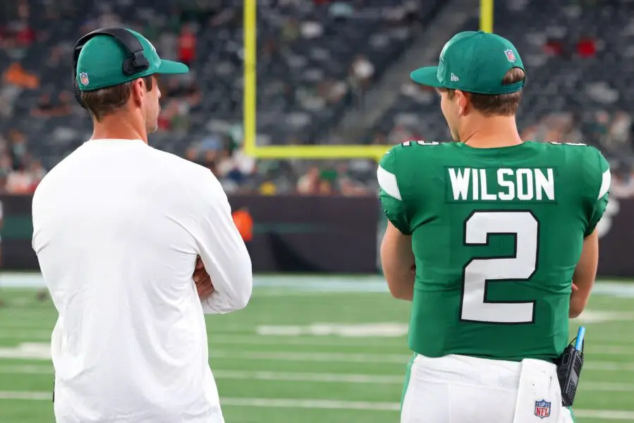 Aug 19, 2023; East Rutherford, New Jersey, USA; New York Jets quarterback Aaron Rodgers (8) and New York Jets quarterback Zach Wilson (2) talk during the second half of their game against the Tampa Bay Buccaneers at MetLife Stadium. Mandatory Credit: Ed Mulholland-USA TODAY Sports (Green Bay Packers)