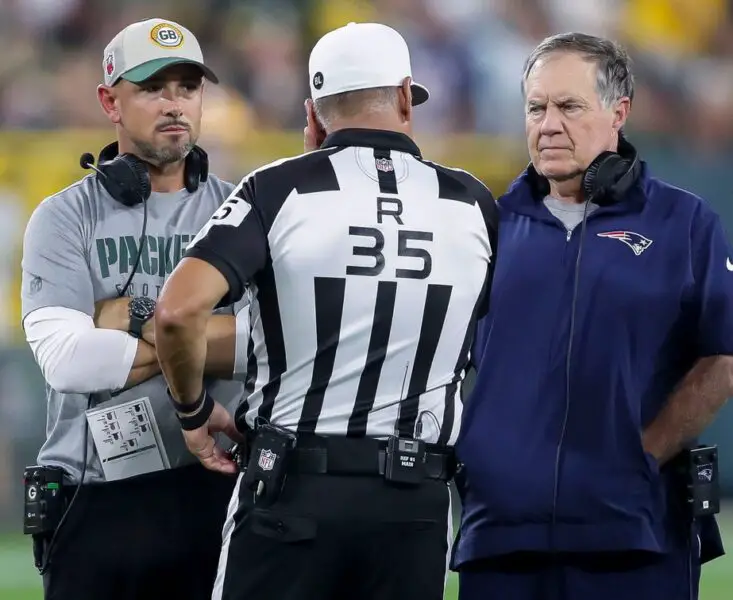 Green Bay Packers head coach Matt LaFleur and New England Patriots head coach Bill Belichick talk with referee John Hussey (35) during their football game Saturday, August 19, 2023, at Lambeau Field in Green Bay, Wis. The game was suspended in the fourth quarter following an injury to New England Patriots cornerback Isaiah Bolden (7). Tork Mason/USA TODAY NETWORK-Wisconsin