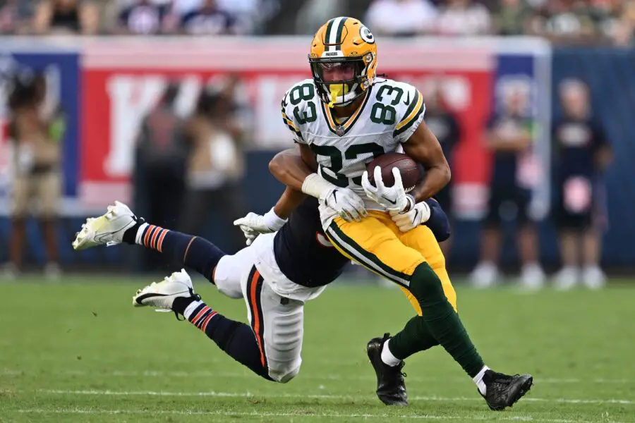 Sep 10, 2023; Chicago, Illinois, USA; Green Bay Packers wide receiver Samori Toure (83) runs for a gain as Chicago Bears linebacker T.J. Edwards (53) hangs on for the tackle in the second half at Soldier Field. Mandatory Credit: Jamie Sabau-USA TODAY Sports