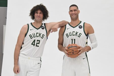 Oct 2, 2023; Milwaukee, WI, USA; Milwaukee Bucks center Brook Lopez (11) and center Robin Lopez (42) pose for pictures during media day in Milwaukee. Mandatory Credit: Benny Sieu-USA TODAY Sports