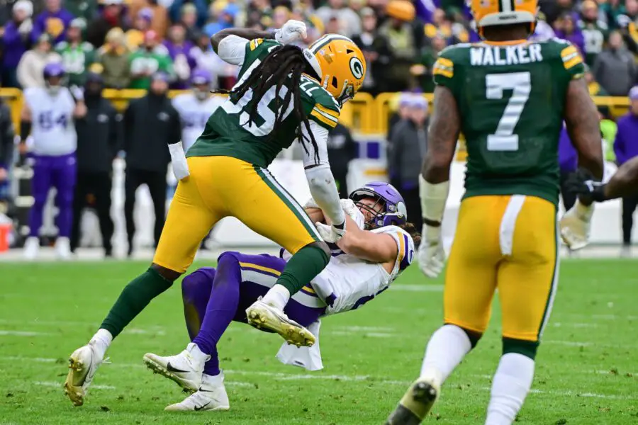 Oct 29, 2023; Green Bay, Wisconsin, USA; Minnesota Vikings tight end T.J. Hockenson (87) catches a pass against Green Bay Packers linebacker De'Vondre Campbell (59) in the fourth quarter at Lambeau Field. Mandatory Credit: Benny Sieu-USA TODAY Sports