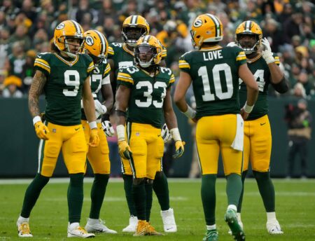 Green Bay Packers running back Aaron Jones (33) with teammates Green Bay Packers wide receiver Christian Watson (9) and Green Bay Packers quarterback Jordan Love (10) during the second quarter of their game against the Los Angeles Rams on Sunday, Nov. 5, 2023 at Lambeau Field in Green Bay.© Mike De Sisti / The Milwaukee Journal Sentinel / USA TODAY NETWORK