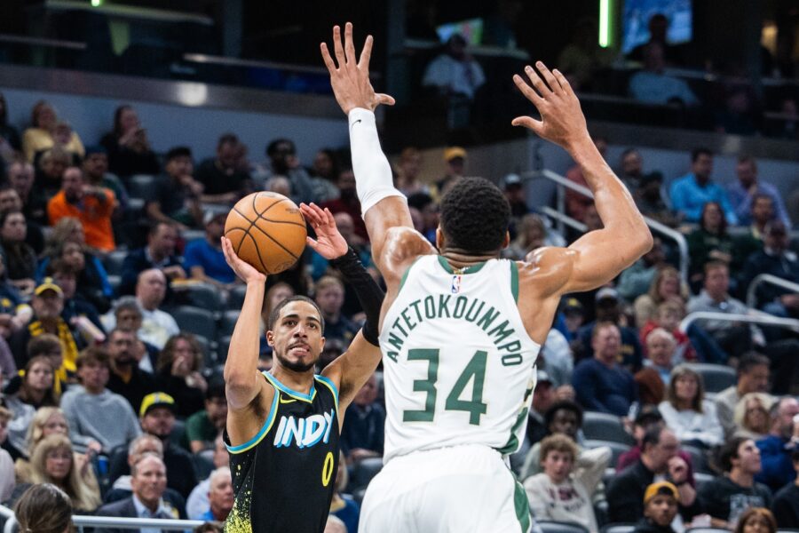 Nov 9, 2023; Indianapolis, Indiana, USA; Indiana Pacers guard Tyrese Haliburton (0) shoots the ball while Milwaukee Bucks forward Giannis Antetokounmpo (34) defends in the second half at Gainbridge Fieldhouse. Mandatory Credit: Trevor Ruszkowski-USA TODAY Sports