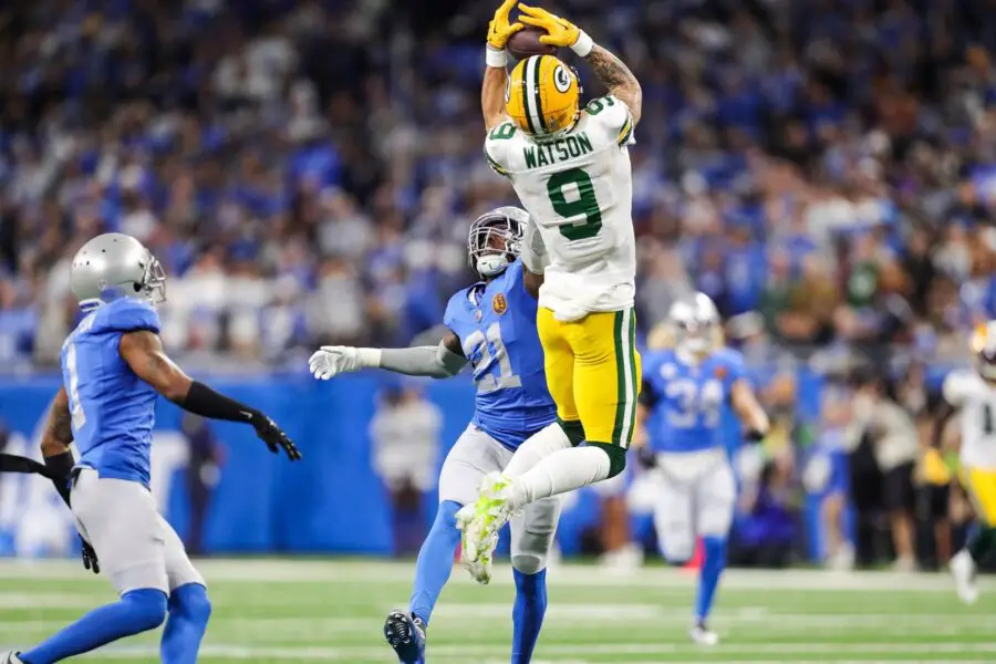 Green Bay Packers receiver Christian Watson makes a leaping 53-yard catch on the first play of the game against Detroit Lions safety Tracy Walker III (21) during the first half at Ford Field in Detroit on Thursday, Nov. 23, 2023.  © Junfu Han / USA TODAY NETWORK