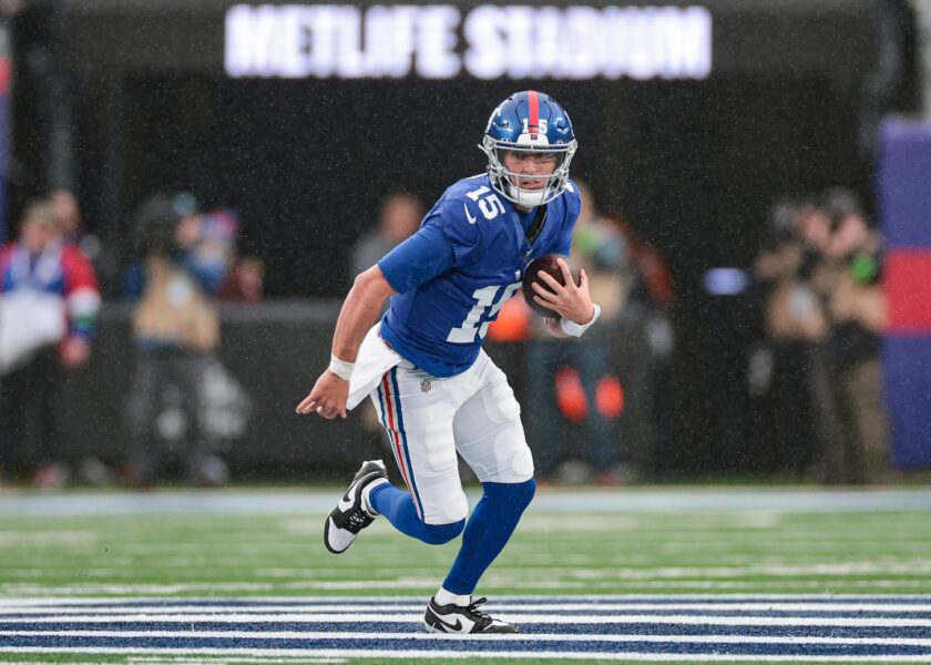 Nov 26, 2023; East Rutherford, New Jersey, USA; New York Giants quarterback Tommy DeVito (15) scrambles during the second half against the New England Patriots at MetLife Stadium. Mandatory Credit: Vincent Carchietta-USA TODAY Sports (Green Bay Packers)
