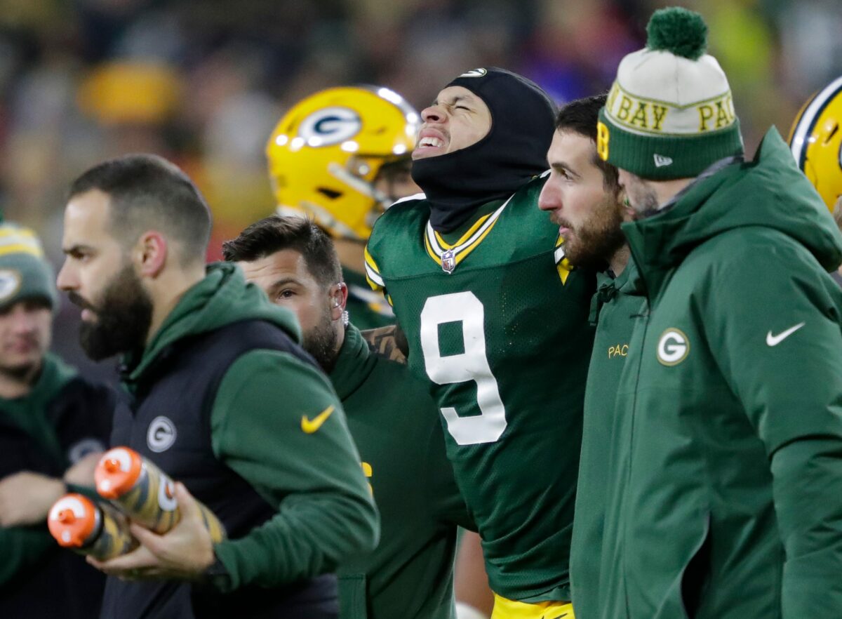Green Bay Packers wide receiver Christian Watson (9) winces in pain as he is helped off the field after injuring his leg on a first down reception against the Kansas City Chiefs during their football game Sunday, December 3, 2023, at Lambeau Field in Green Bay, Wis. Dan Powers/USA TODAY NETWORK-Wisconsin.