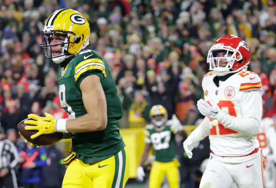 Green Bay Packers wide receiver Christian Watson (9) scores a touchdown against Kansas City Chiefs cornerback Trent McDuffie (22) during their football game Sunday, December 3, 2023, at Lambeau Field in Green Bay, Wis. Dan Powers/USA TODAY NETWORK-Wisconsin.