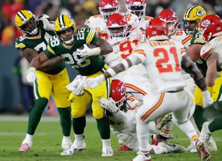 Green Bay Packers running back AJ Dillon (28) runs for a gain against the Kansas City Chiefs during their football game Sunday, December 3, 2023, at Lambeau Field in Green Bay, Wis. Dan Powers/USA TODAY NETWORK-Wisconsin. (Aaron Rodgers)