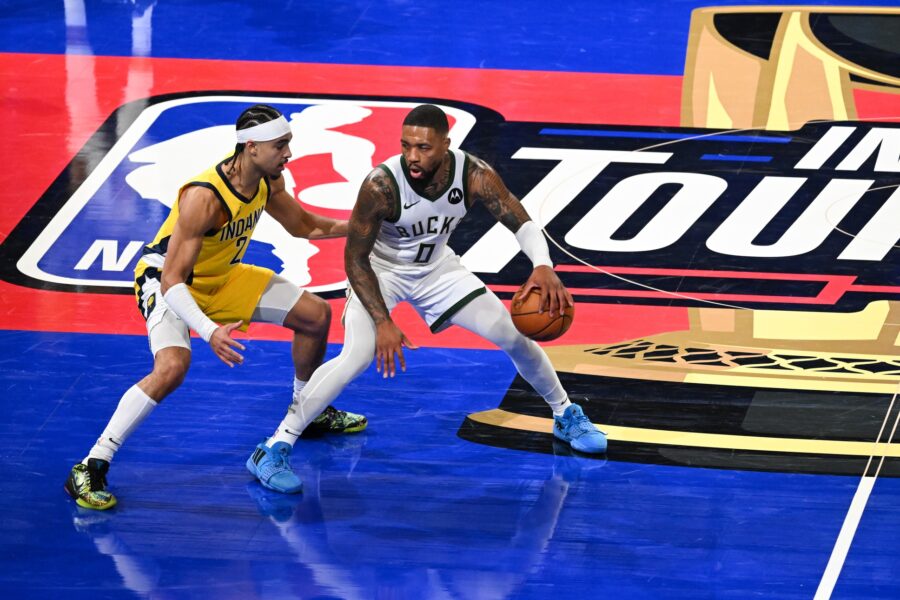 Dec 7, 2023; Las Vegas, Nevada, USA; Milwaukee Bucks guard Damian Lillard (0) dribbles the ball as Indiana Pacers guard Andrew Nembhard (2) defends during the third quarter at T-Mobile Arena. Mandatory Credit: Candice Ward-USA TODAY Sports