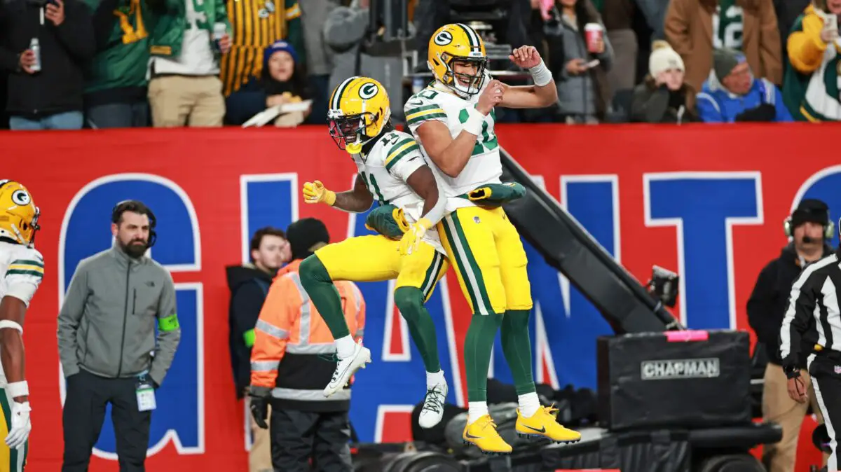 Green Bay Packers quarterback Jordan Love celebrates a touchdown with wide receiver Jayden Reed