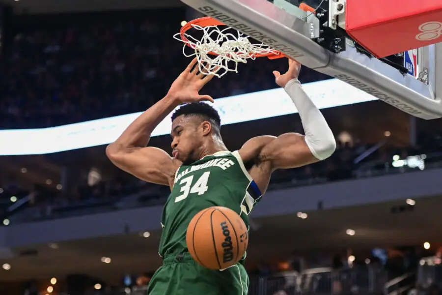 Dec 16, 2023; Milwaukee, Wisconsin, USA; Milwaukee Bucks forward Giannis Antetokounmpo (34) dunks a basket in the third quarter against the Detroit Pistons at Fiserv Forum. Mandatory Credit: Benny Sieu-USA TODAY Sports