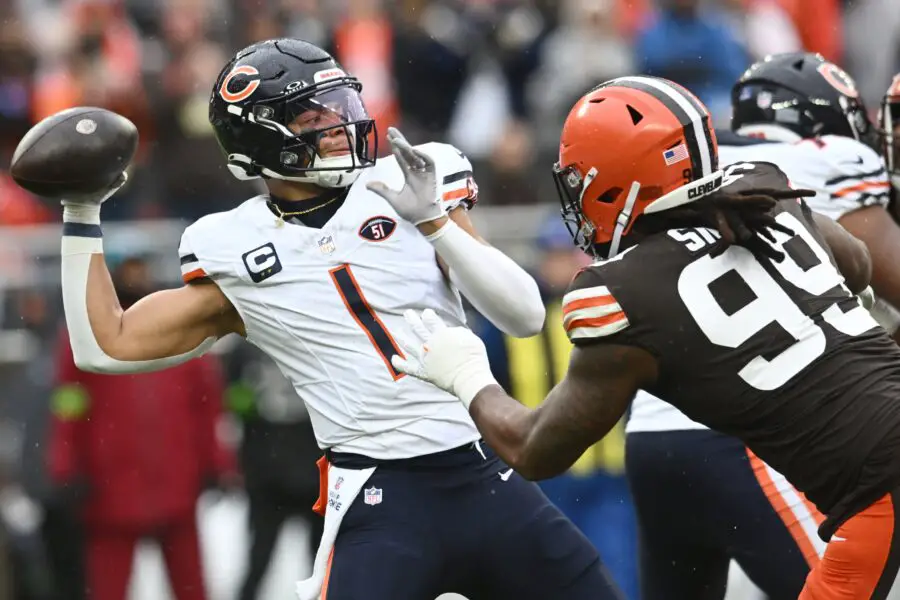 Dec 17, 2023; Cleveland, Ohio, USA; Chicago Bears quarterback Justin Fields (1) throws a pass during the first quarter as Cleveland Browns defensive end Za'Darius Smith (99) rushes at Cleveland Browns Stadium. Mandatory Credit: Ken Blaze-USA TODAY Sports (Green Bay Packers)