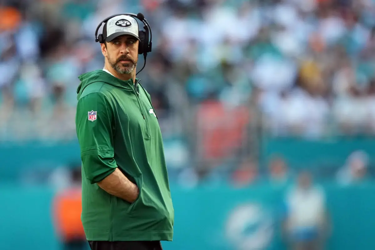 Dec 17, 2023; Miami Gardens, Florida, USA; New York Jets quarterback Aaron Rodgers (8) walks onto the field during an injury timeout in the first half against the Miami Dolphins at Hard Rock Stadium. Mandatory Credit: Jasen Vinlove-USA TODAY Sports