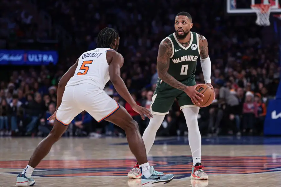 Dec 25, 2023; New York, New York, USA; Milwaukee Bucks guard Damian Lillard (0) is guarded by New York Knicks guard Immanuel Quickley (5) during the second half at Madison Square Garden. Mandatory Credit: Vincent Carchietta-USA TODAY Sports
