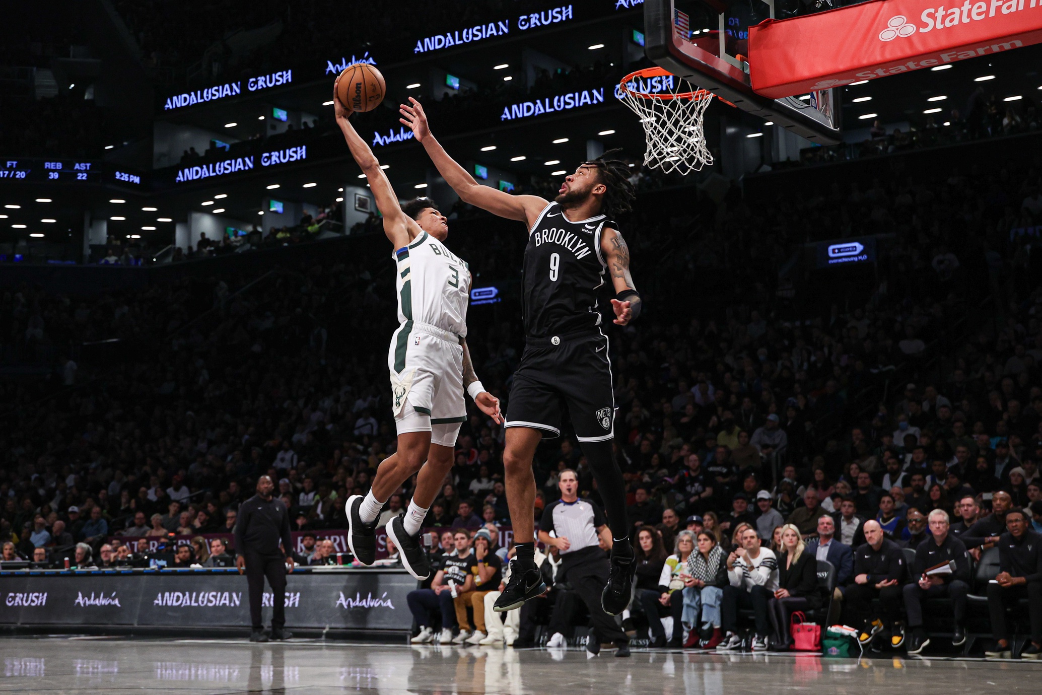 Dec 27, 2023; Brooklyn, New York, USA; Milwaukee Bucks forward MarJon Beauchamp (3) goes up for a dunk against Brooklyn Nets forward Trendon Watford (9) during the second half at Barclays Center. Mandatory Credit: Vincent Carchietta-USA TODAY Sports