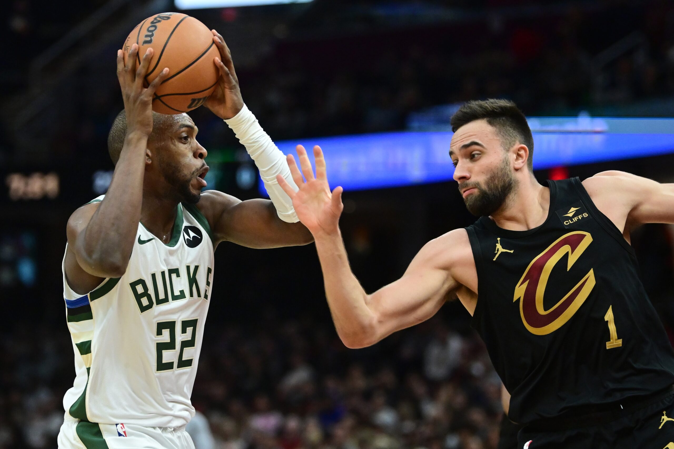 Dec 29, 2023; Cleveland, Ohio, USA; Cleveland Cavaliers guard Max Strus (1) defends Milwaukee Bucks forward Khris Middleton (22) during the second half at Rocket Mortgage FieldHouse. Mandatory Credit: Ken Blaze-USA TODAY Sports