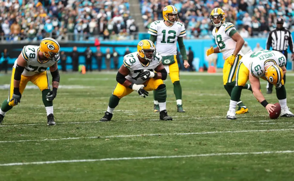 Dec 17, 2017; Charlotte, NC, USA; Green Bay Packers offensive tackle Jason Spriggs (78), offensive guard Jahri Evans (73), center Corey Linsley (63) wait for the snap to quarterback Aaron Rodgers (12)during the second quarter at Bank of America Stadium. Mandatory Credit: Jim Dedmon-USA TODAY Sports