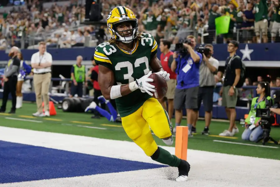 Oct 6, 2019; Arlington, TX, USA; Green Bay Packers running back Aaron Jones (33) scores a touchdown against the Dallas Cowboys in the third quarter at AT&T Stadium. Mandatory Credit: Tim Heitman-USA TODAY Sports