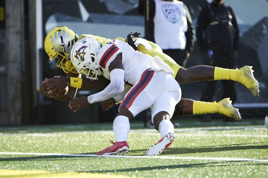 Sep 18, 2021; Eugene, Oregon, USA; Oregon Ducks quarterback Anthony Brown (13) dives into the end zone for a touchdown during the first half against Stony Brook Seawolves defensive back Carthell Flowers (17) at Autzen Stadium. Mandatory Credit: Troy Wayrynen-USA TODAY Sports (Green Bay Packers)