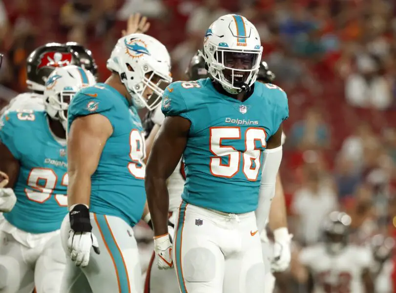 Aug 13, 2022; Tampa, Florida, USA;Miami Dolphins linebacker Deandre Johnson (56) celebrates as he sacks Tampa Bay Buccaneers quarterback Kyle Trask (2) (not pictured) during the second half at Raymond James Stadium. Mandatory Credit: Kim Klement-USA TODAY Sports (Green Bay Packers)