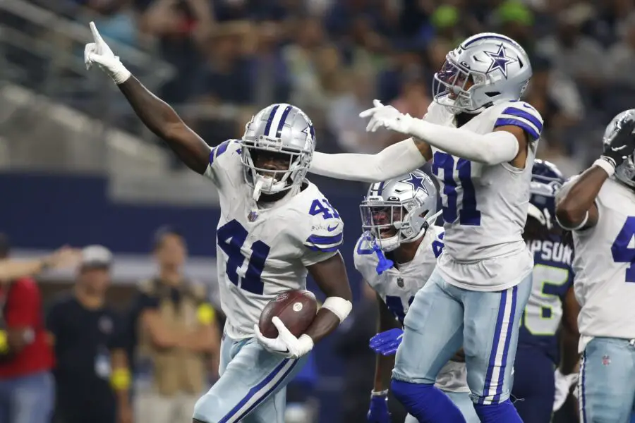 Aug 26, 2022; Arlington, Texas, USA; Dallas Cowboys safety Markquese Bell (41) celebrates making an interception against the Seattle Seahawks along with safety Tyler Coyle (31 in the third quarter along with safety Tyler Coyle (31) at AT&T Stadium. Mandatory Credit: Tim Heitman-USA TODAY Sports