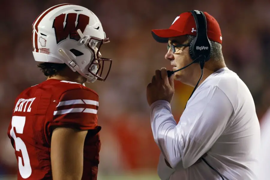 Sep 3, 2022; Madison, Wisconsin, USA; Wisconsin Badgers head coach Paul Chryst talks with quarterback Graham Mertz (5) during the third quarter against the Illinois State Redbirds at Camp Randall Stadium. Mandatory Credit: Jeff Hanisch-USA TODAY Sports