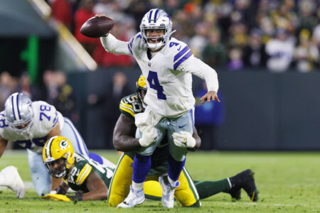 Nov 13, 2022; Green Bay, Wisconsin, USA; Dallas Cowboys quarterback Dak Prescott (4) throws a pass during overtime against the Green Bay Packers at Lambeau Field. Mandatory Credit: Jeff Hanisch-USA TODAY Sports