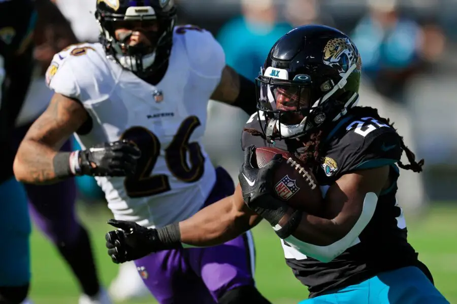 Jacksonville Jaguars running back JaMycal Hasty (22) rushes for yards against Baltimore Ravens safety Geno Stone (26) during the second quarter of a regular season NFL football matchup Sunday, Nov. 27, 2022 at TIAA Bank Field in Jacksonville. The Jaguars edged the Ravens 28-27. [Corey Perrine/Florida Times-Union] © Corey Perrine/Florida Times-Union / USA TODAY NETWORK (Green Bay Packers)