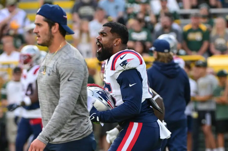 Aug 19, 2023; Green Bay, Wisconsin, USA; New England Patriots running back Ezekiel Elliott (15) reacts during a scuffle before game against the Green Bay Packers at Lambeau Field. Mandatory Credit: Benny Sieu-USA TODAY Sports