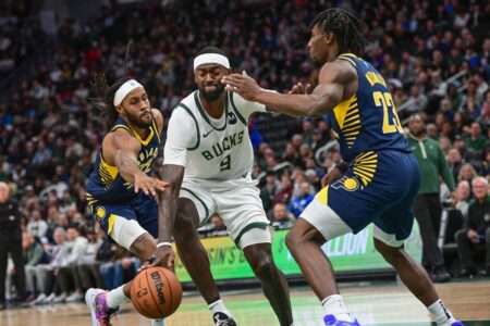 Dec 13, 2023; Milwaukee, Wisconsin, USA; Milwaukee Bucks forward Bobby Portis (9) gets pressure from Indiana Pacers center Aaron Nesmith (23) and center Isaiah Jackson (22) in the third quarter at Fiserv Forum. Mandatory Credit: Benny Sieu-USA TODAY Sports