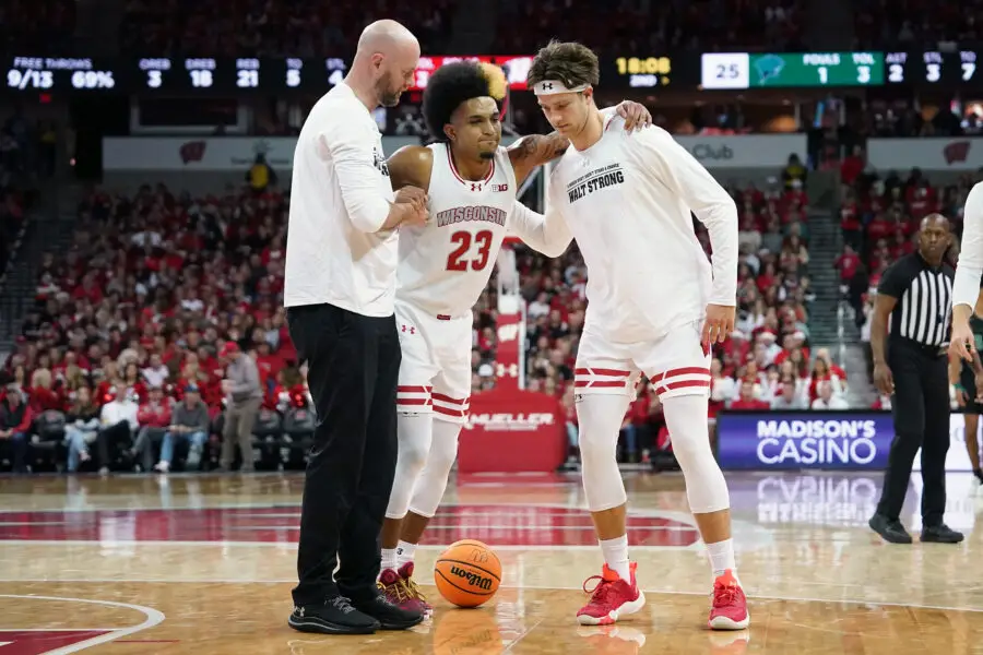 Wisconsin basketball starting point guard Chucky Hepburn was helped off the court after suffering an injury in a game against Chicago State
