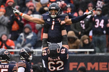 Dec 31, 2023; Chicago, Illinois, USA; Chicago Bears quarterback Justin Fields (1) celebrates with offensive lineman Lucas Patrick (62) after running for a 9-yard touchdown in the first half against the Atlanta Falcons at Soldier Field. Mandatory Credit: Jamie Sabau-USA TODAY Sports