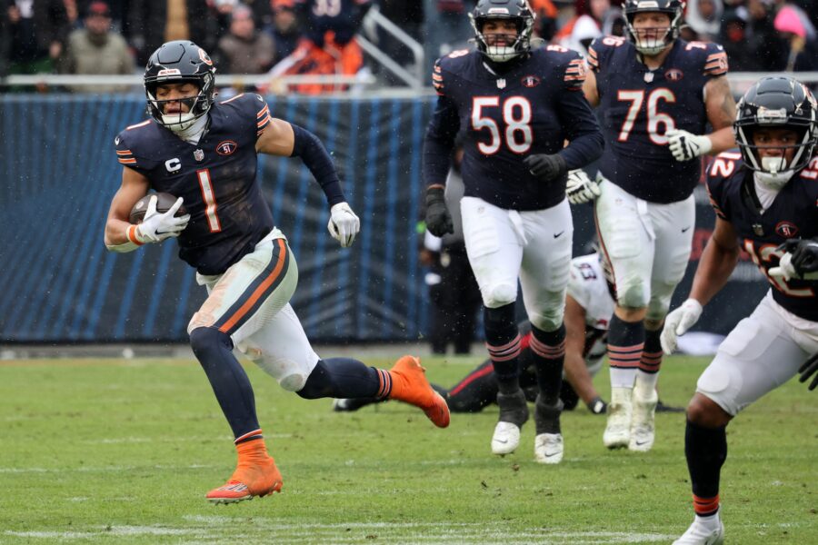 Dec 31, 2023; Chicago, Illinois, USA; Chicago Bears quarterback Justin Fields (1) rushes the ball against the Atlanta Falcons during the second half at Soldier Field. Mandatory Credit: Mike Dinovo-USA TODAY Sports (Green Bay Packers)