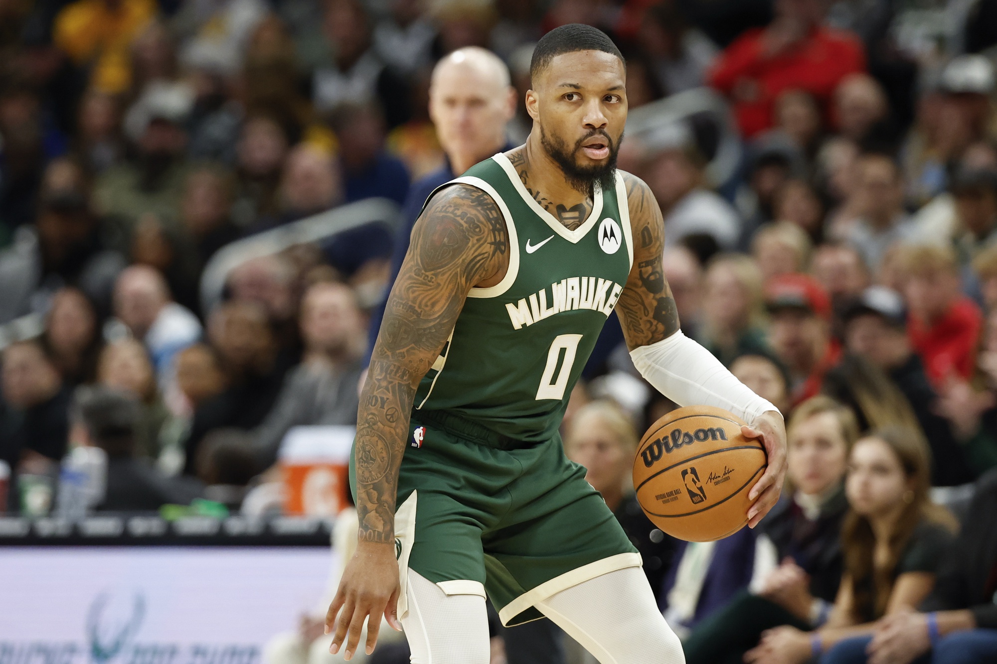 Jan 1, 2024; Milwaukee, Wisconsin, USA; Milwaukee Bucks guard Damian Lillard (0) brings the ball up court against the Indiana Pacers during the first half at Fiserv Forum. Mandatory Credit: Kamil Krzaczynski-USA TODAY Sports