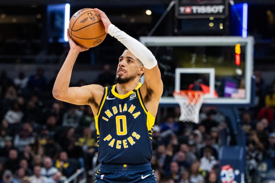 Jan 3, 2024; Indianapolis, Indiana, USA; Indiana Pacers guard Tyrese Haliburton (0) shoots the ball in the second half against the Milwaukee Bucks at Gainbridge Fieldhouse. Mandatory Credit: Trevor Ruszkowski-USA TODAY Sports